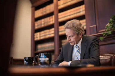 Mike McDivitt working in his office - McDivitt Law Firm